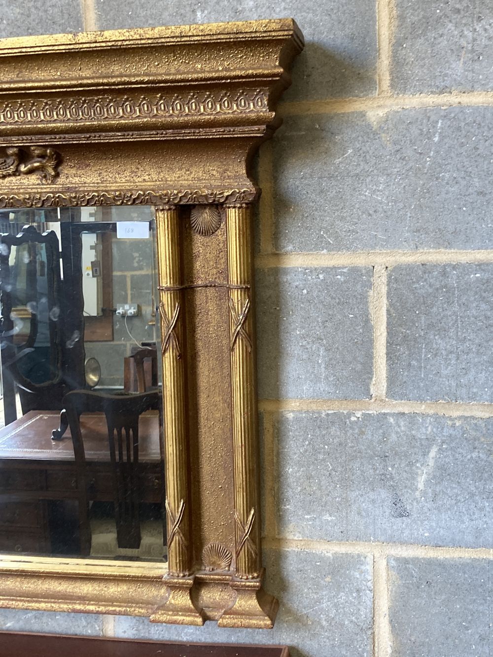 A gilt-framed overmantel mirror, width 138cm, height 91cm